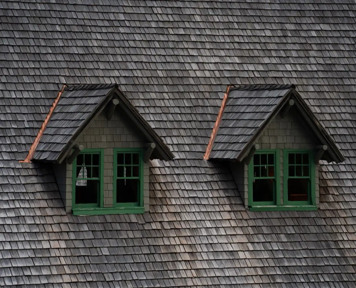 Dormers on a shingle roof in Ogden, UT, where step flashing and kickout flashing carry water past the walls